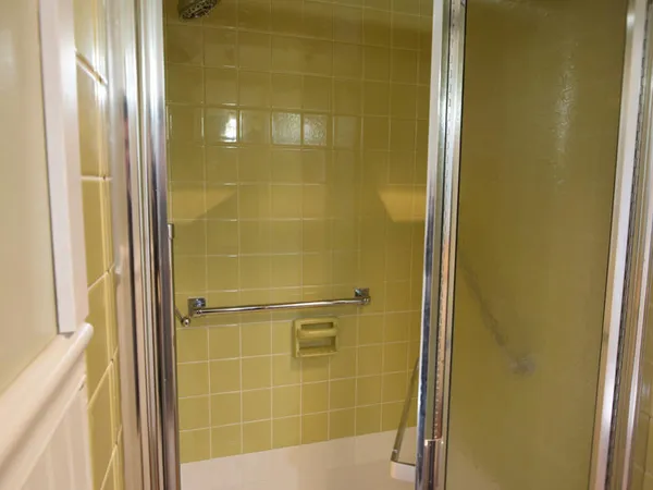 a bathroom with a glass door shower