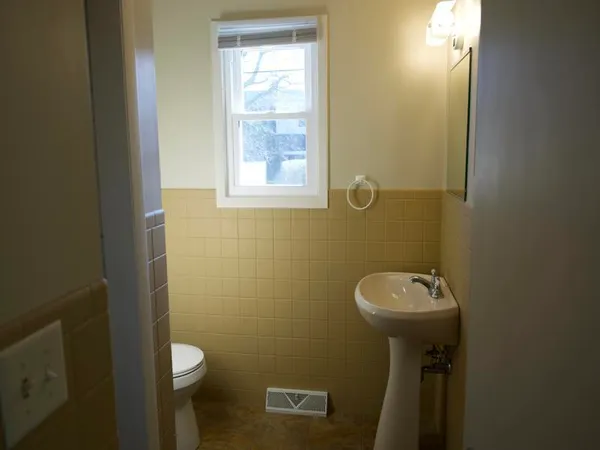a bathroom with a sink and toilet