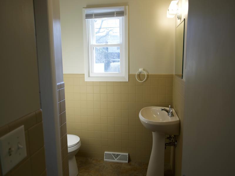 308 Granada Road Bloomington, IL 61701 - Photo 22 of 38 a bathroom with a sink and toilet