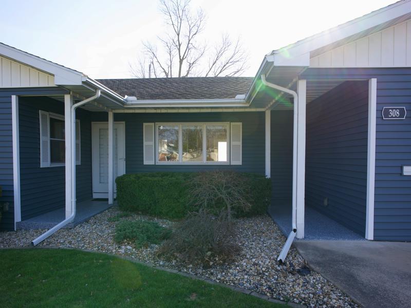 308 Granada Road Bloomington, IL 61701 - Photo 3 of 38 a front view of a house with garden