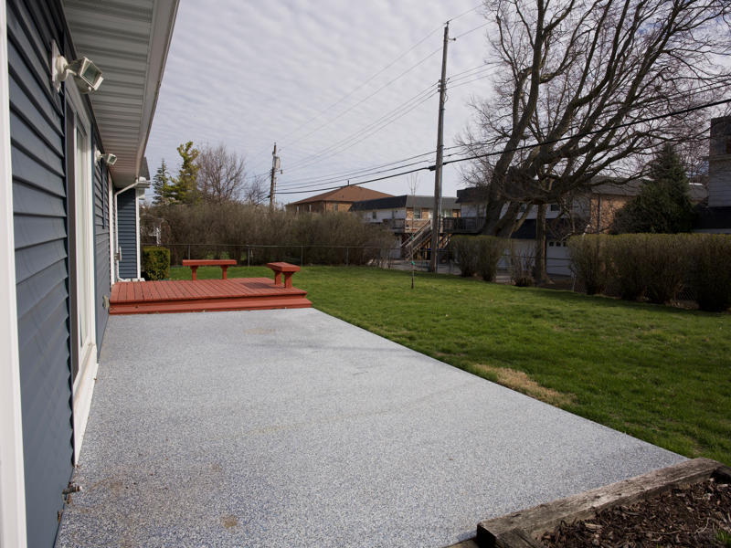 308 Granada Road Bloomington, IL 61701 - Photo 35 of 38 a backyard of a house with lots of green space and fountain