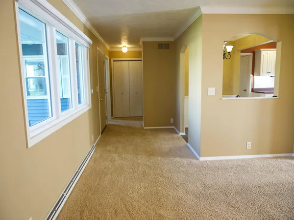 a view of a hallway with windows