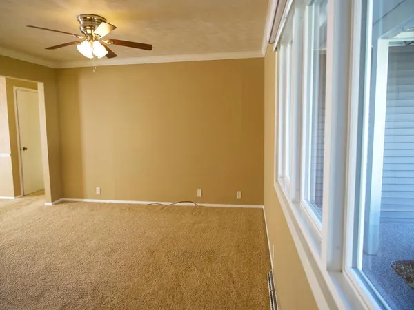 a view of an empty room with a window