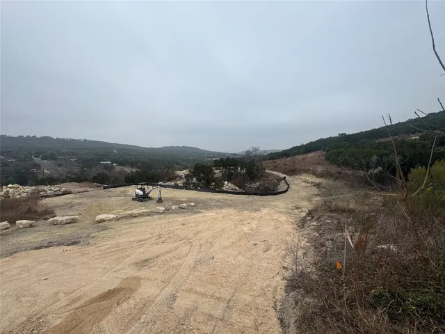 a view of a lake in middle of forest