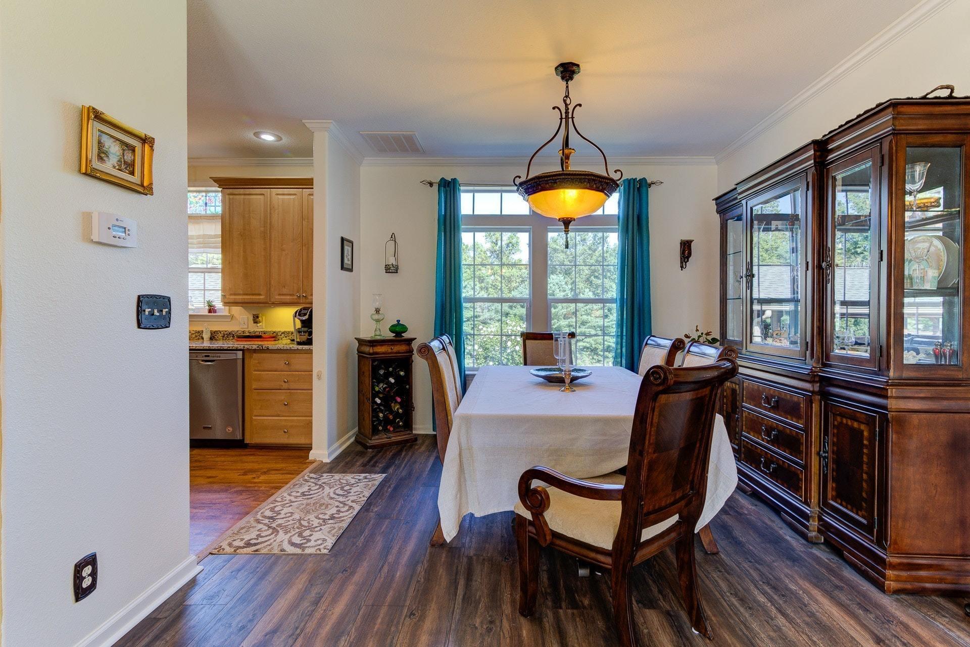2494 Henry Road Ferrum, VA 24088 - Photo 12 of 60 a view of a dining room with furniture window and wooden floor