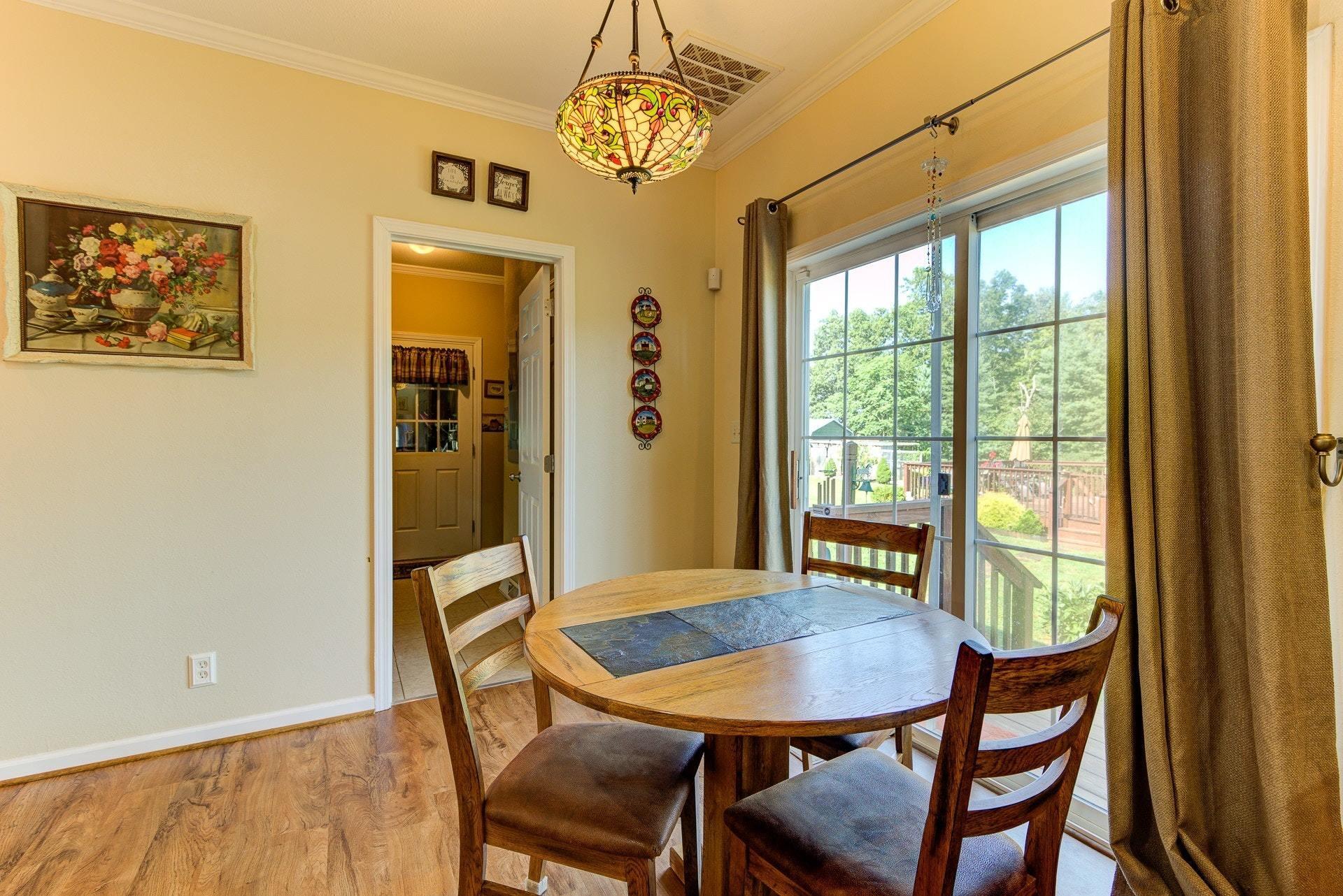 2494 Henry Road Ferrum, VA 24088 - Photo 17 of 60 a view of a dining room with furniture and window