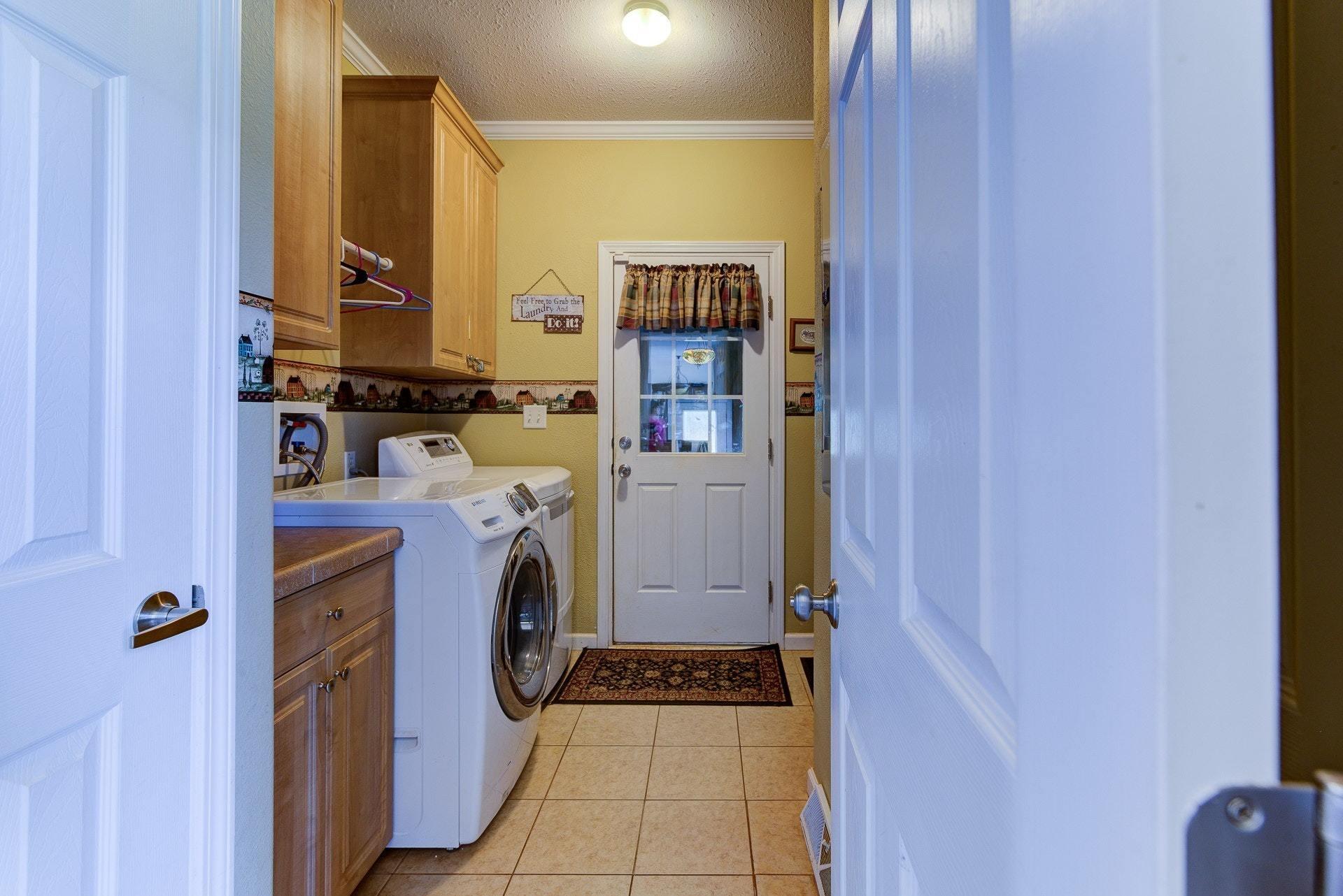 2494 Henry Road Ferrum, VA 24088 - Photo 20 of 60 a bathroom with a sink a washer and dryer