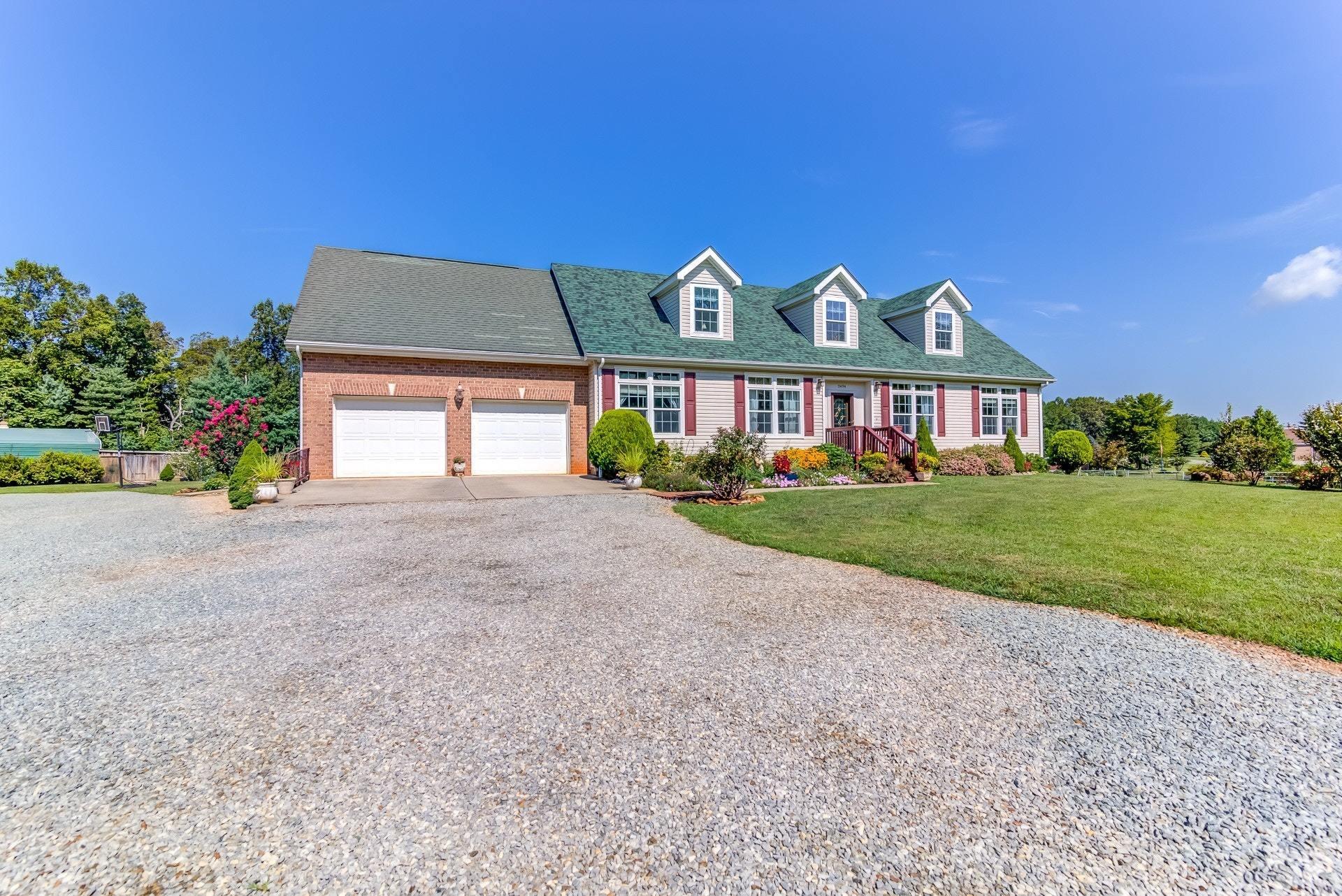 2494 Henry Road Ferrum, VA 24088 - Photo 3 of 60 a view of a big house with a big yard and potted plants