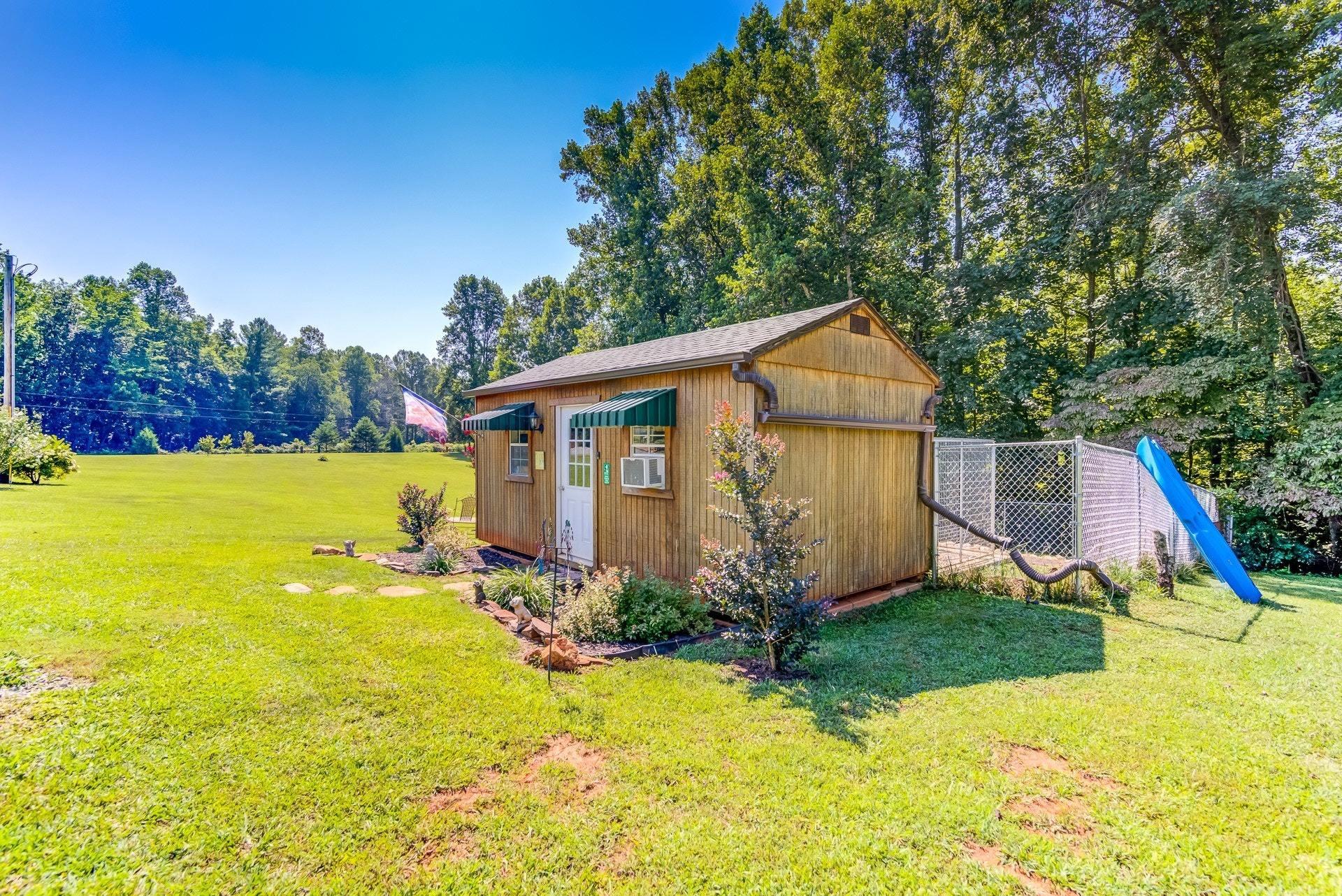 2494 Henry Road Ferrum, VA 24088 - Photo 42 of 60 a view of a house with backyard and garden