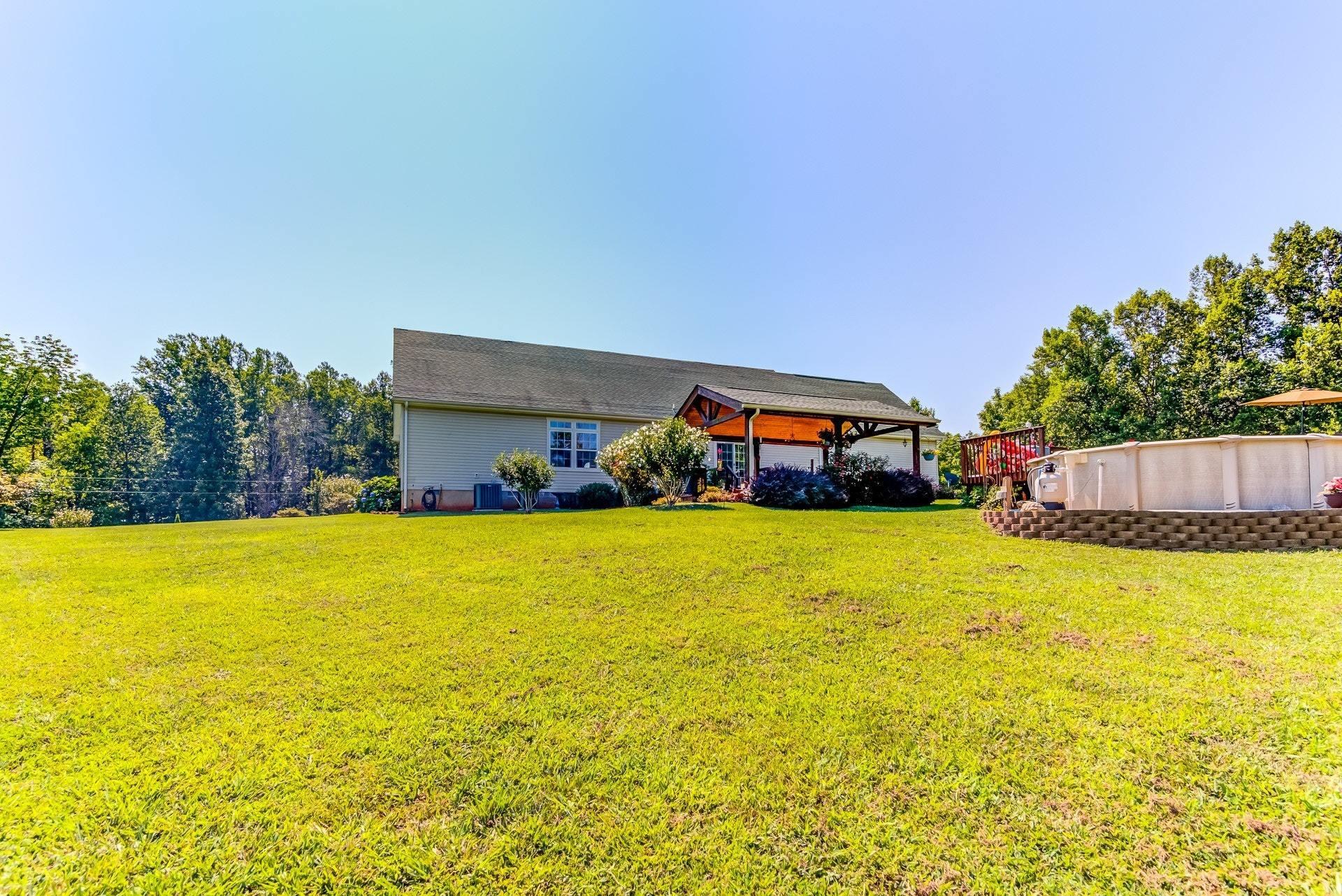 2494 Henry Road Ferrum, VA 24088 - Photo 43 of 60 a swimming pool with an outdoor seating and yard