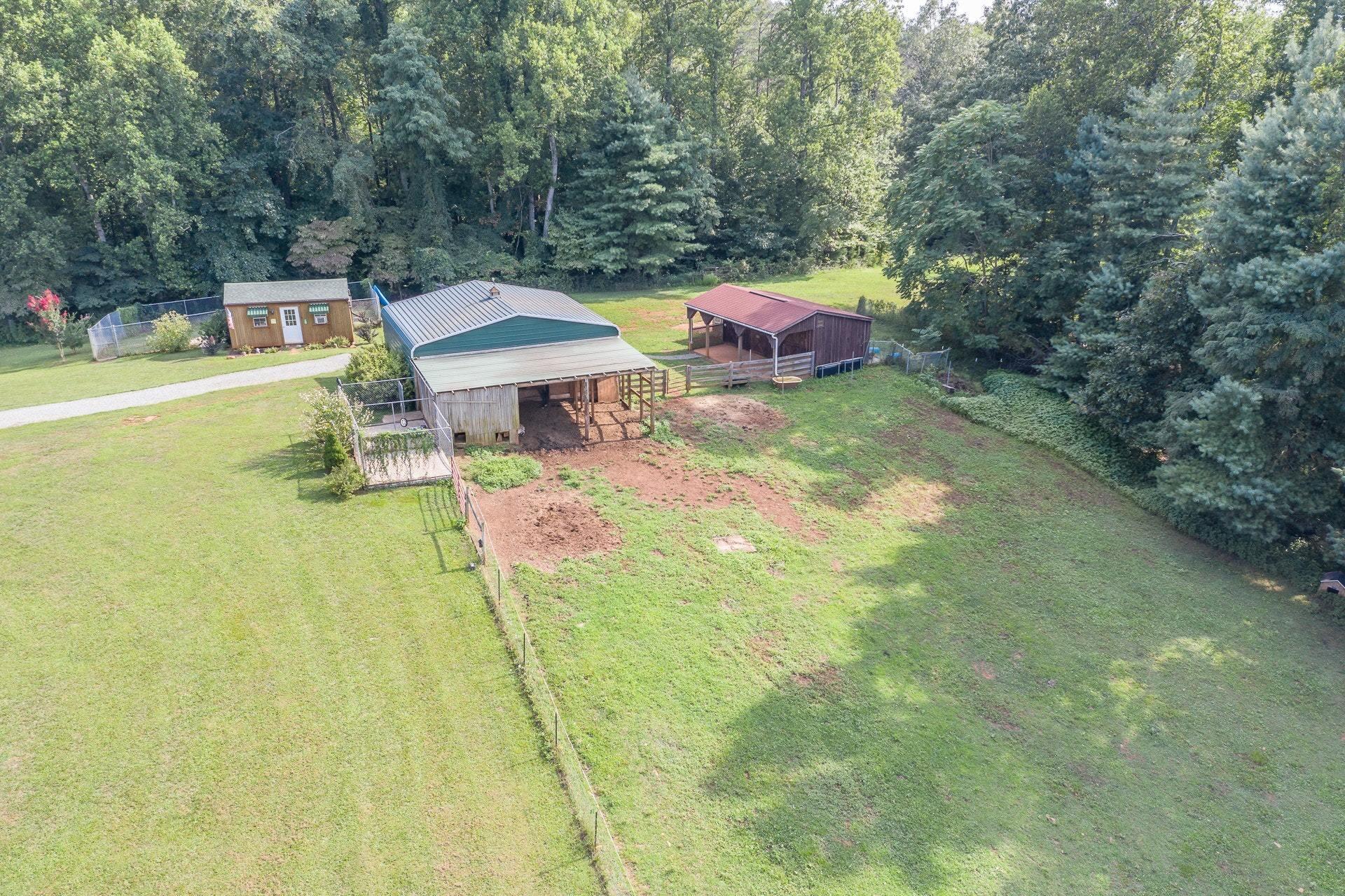 2494 Henry Road Ferrum, VA 24088 - Photo 47 of 60 a backyard of a house with table and chairs