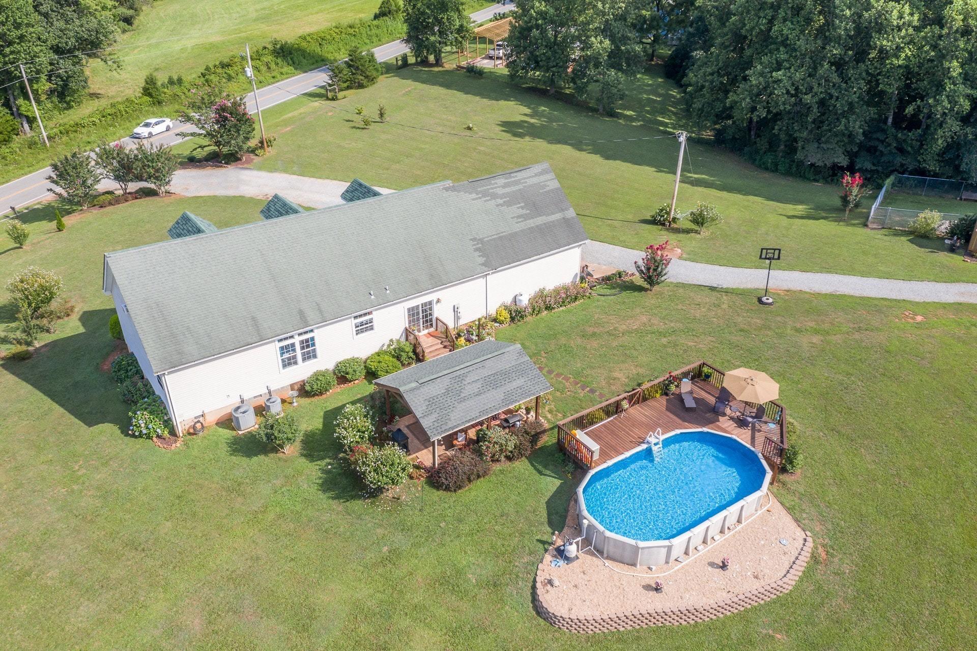 2494 Henry Road Ferrum, VA 24088 - Photo 6 of 60 an aerial view of a house with a yard and lake view