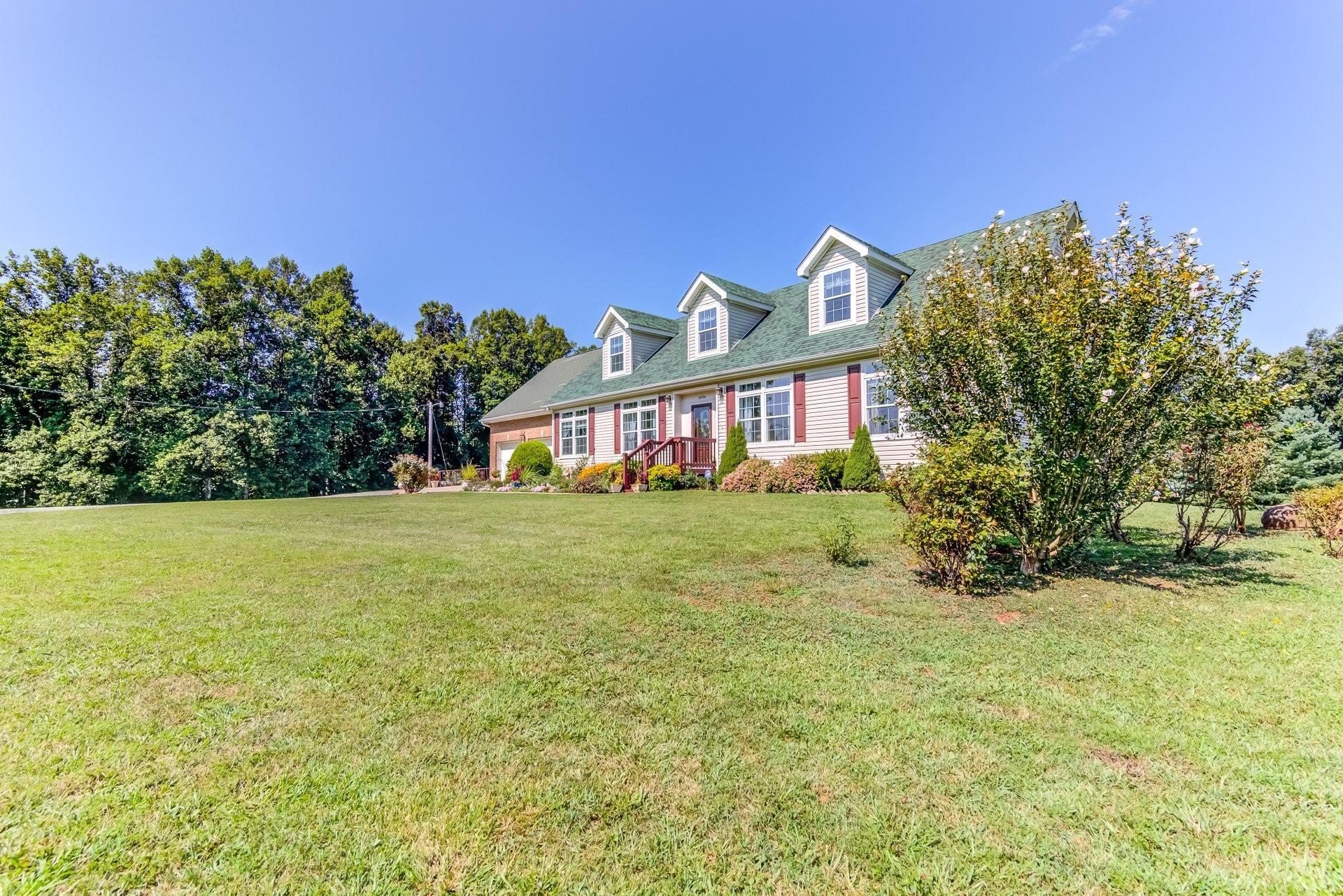 2494 Henry Road Ferrum, VA 24088 - Photo 58 of 60 a front view of house with yard and trees in the background