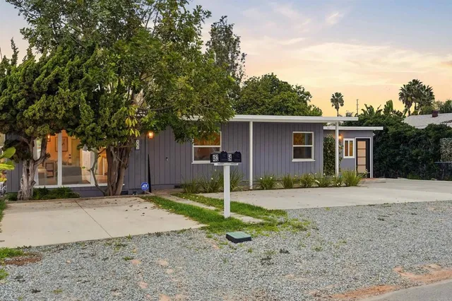 a house with a tree in front of it