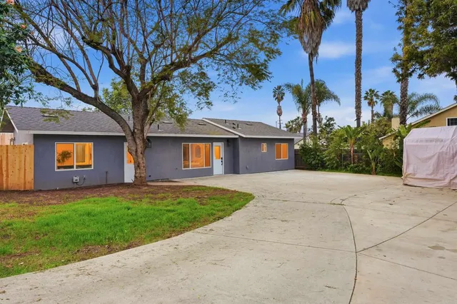 a kitchen with appliances a sink and cabinets