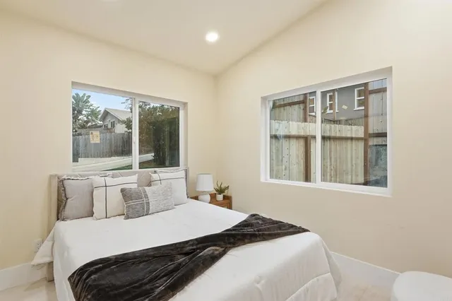 a view of a patio with table and chairs with wooden floor