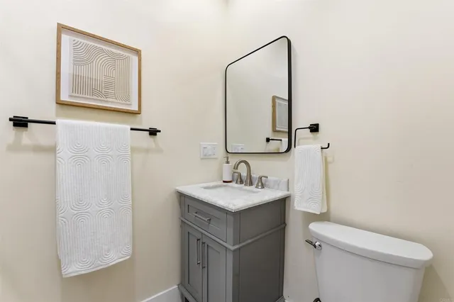 a kitchen with stainless steel appliances a sink and cabinets