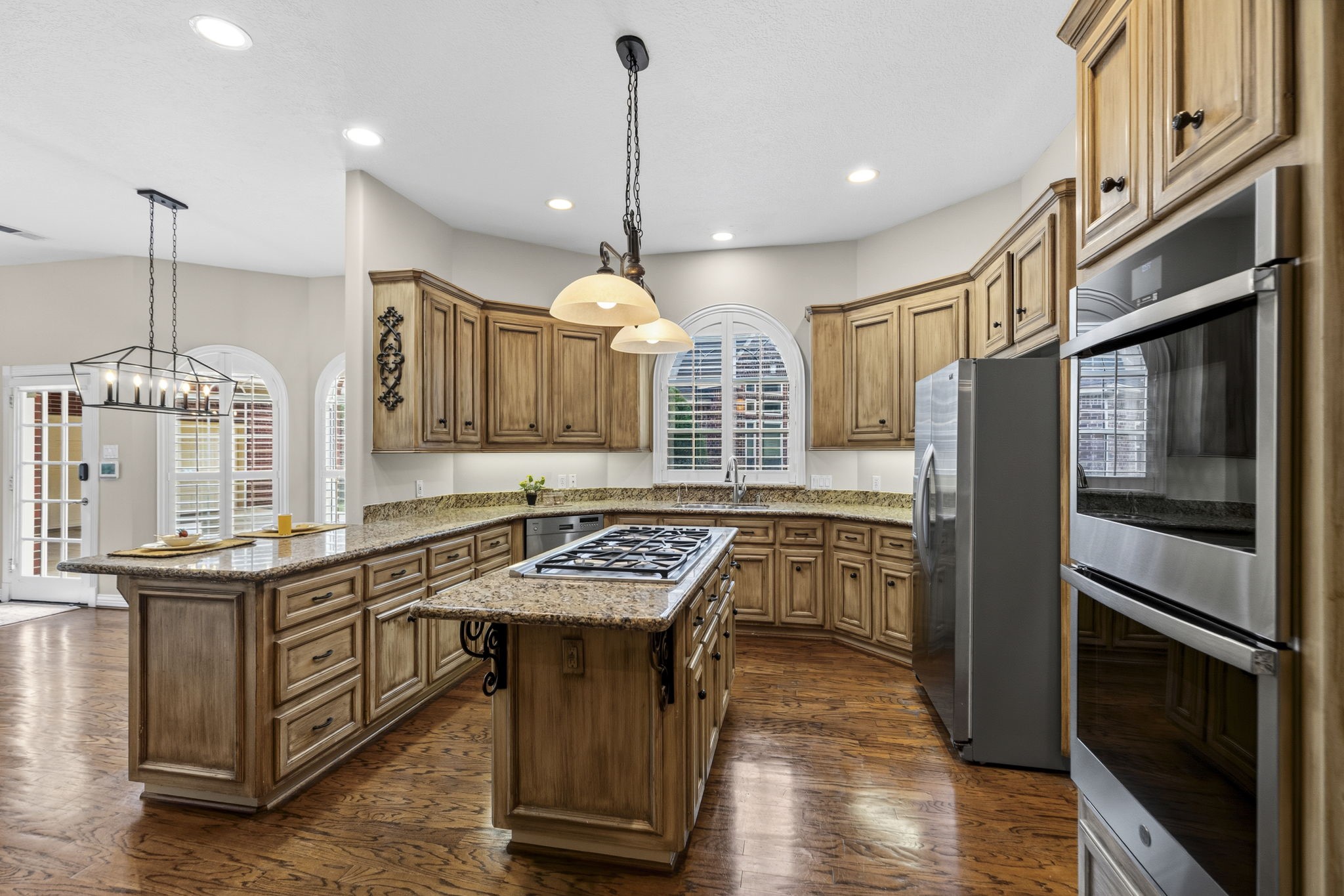 18310 Pamela Way Spring, TX 77379 - Photo 12 of 42 Storage and counterspace galore: A chef's dream kitchen featuring extensive cabinetry and a spacious layout.