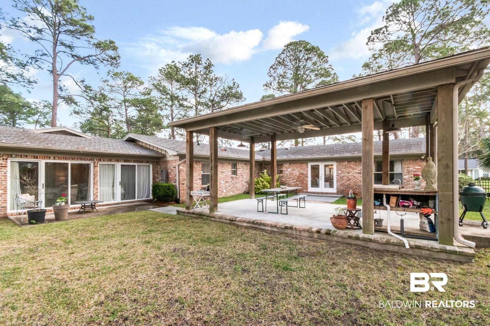 154 Fenwick Road Mobile, AL 36608 - Photo 37 of 48 Rear view of house featuring french doors, brick siding, a yard, and a patio