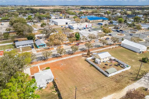 an aerial view of a house with a swimming pool