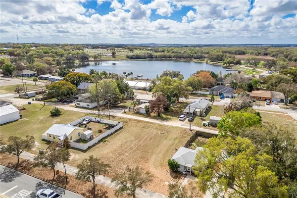 an aerial view of a house with a lake view