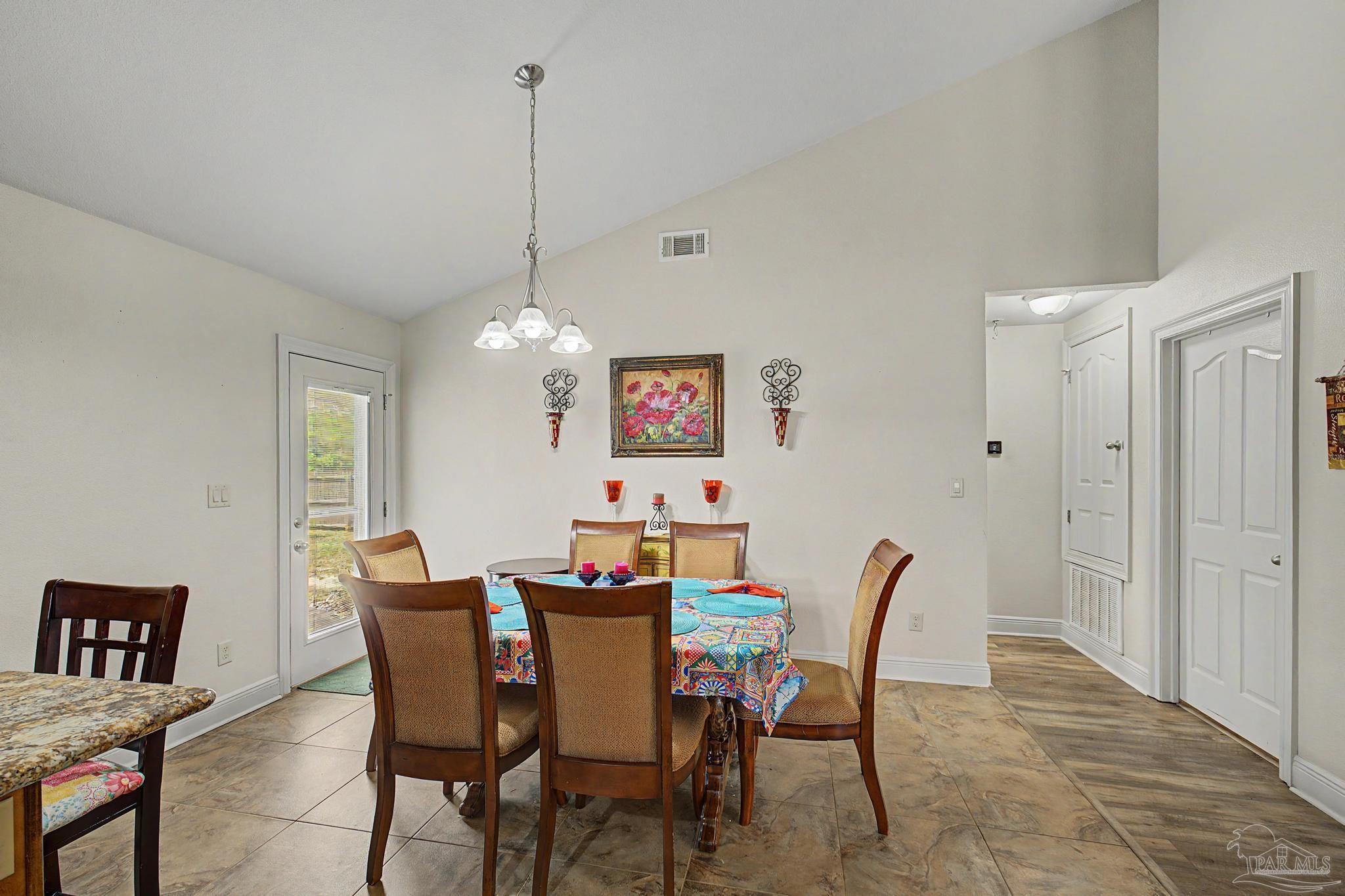 5461 Tucker Circle Pace, FL 32571 - Photo 18 of 52 a dining room with furniture and window