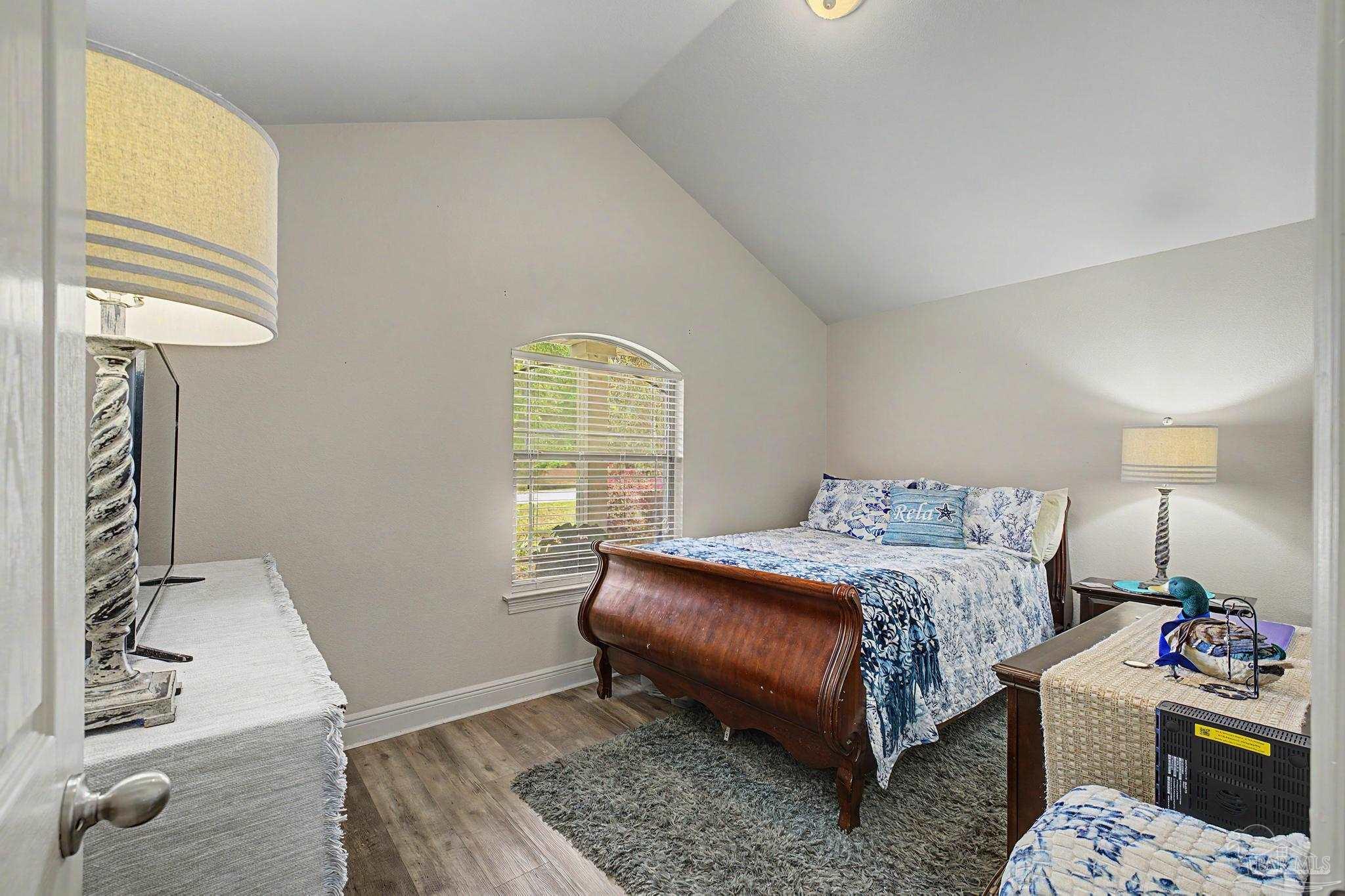 5461 Tucker Circle Pace, FL 32571 - Photo 26 of 52 a bedroom with a bed and a window