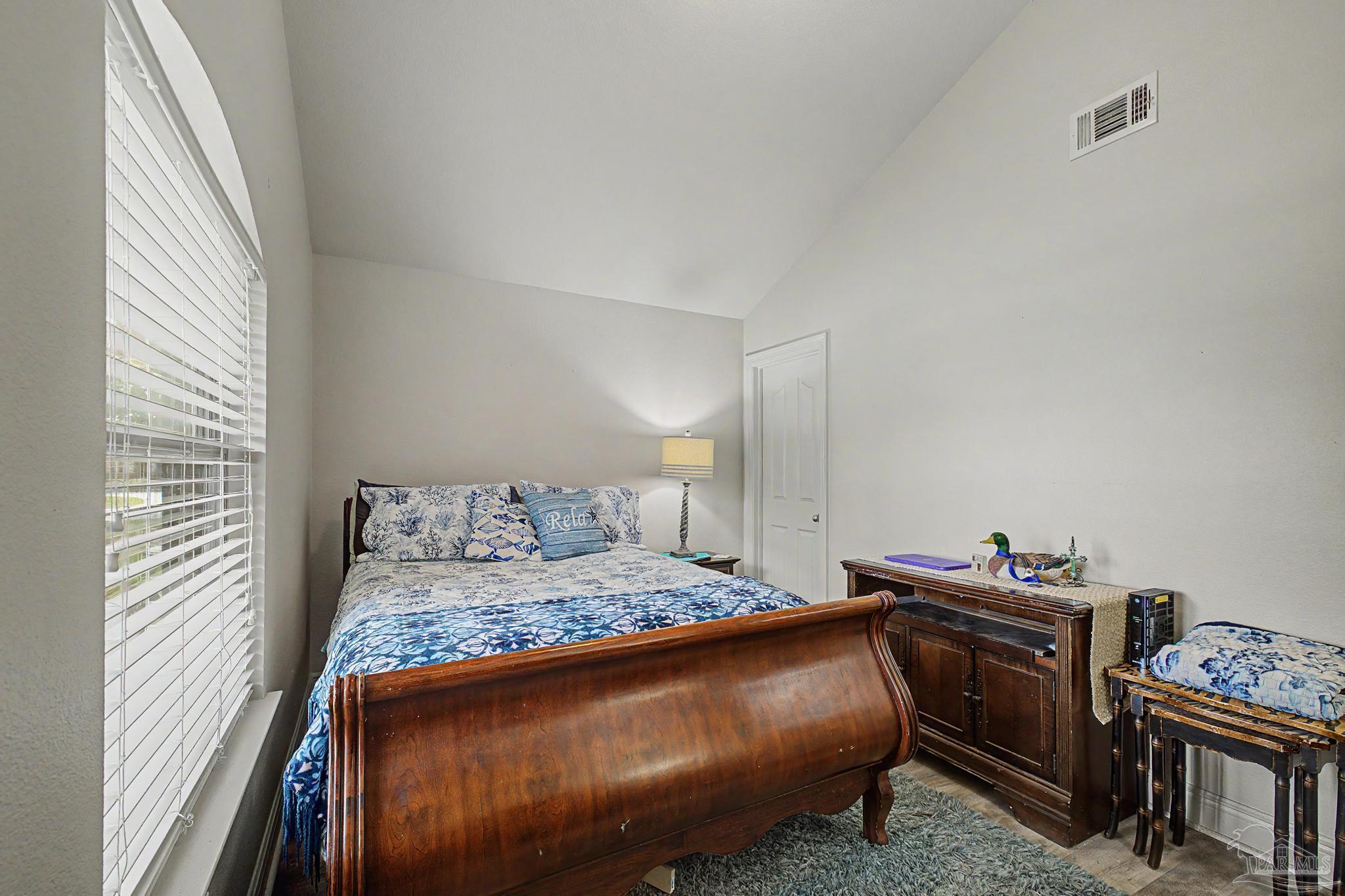 5461 Tucker Circle Pace, FL 32571 - Photo 27 of 52 a bedroom with a bed and a piano in it
