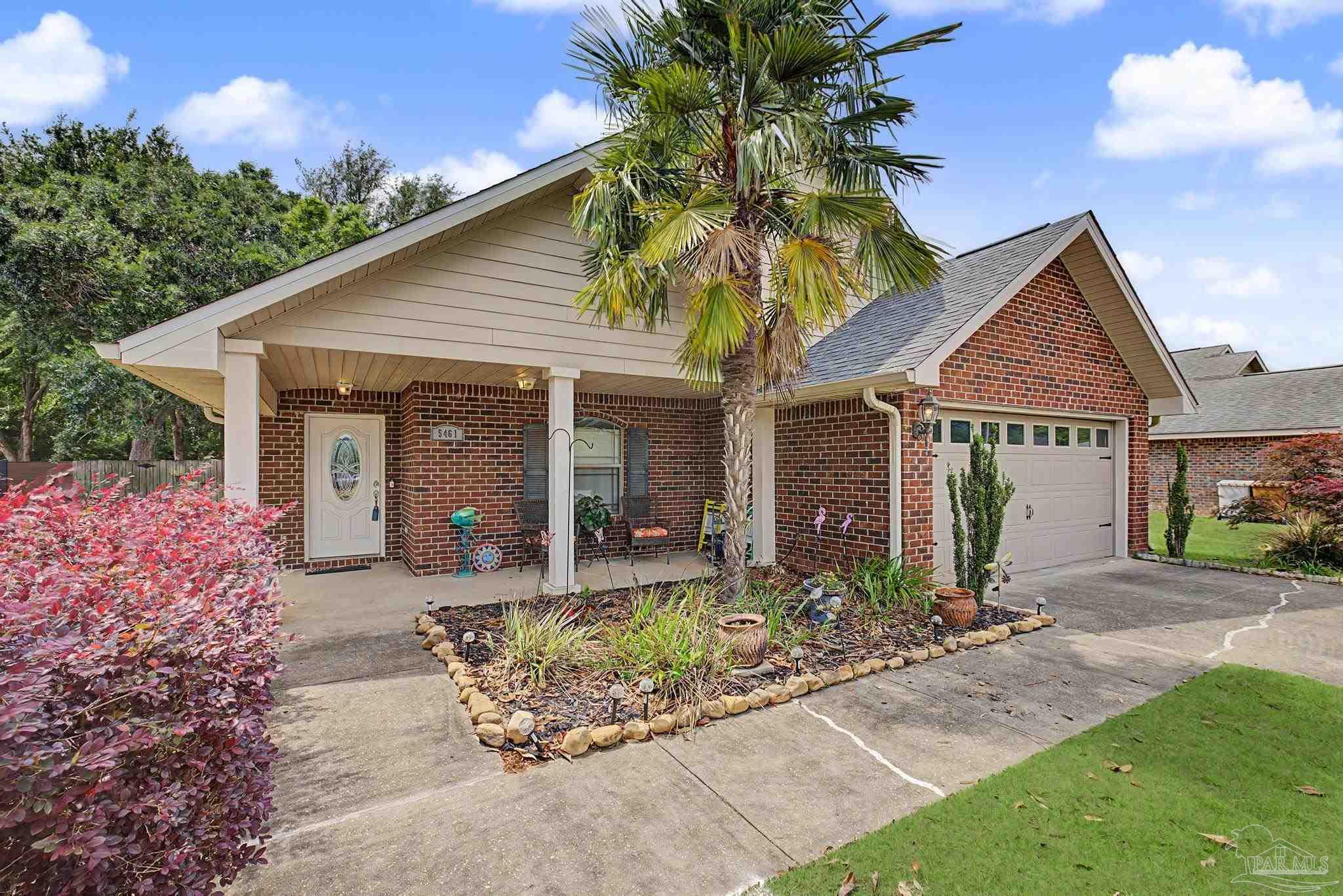 5461 Tucker Circle Pace, FL 32571 - Photo 45 of 52 a front view of house with yard outdoor seating and barbeque oven