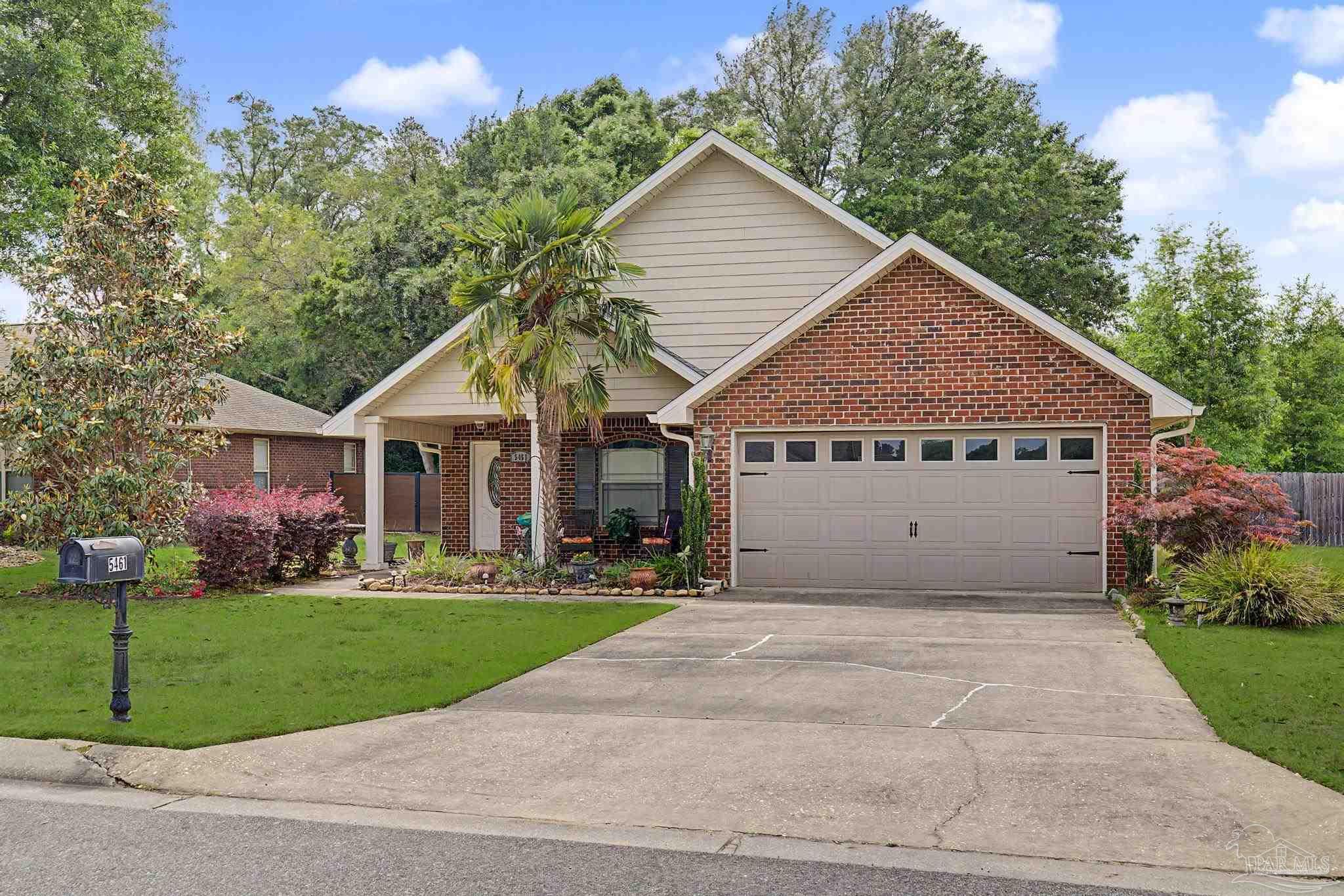 5461 Tucker Circle Pace, FL 32571 - Photo 50 of 52 a view of house with yard and green space