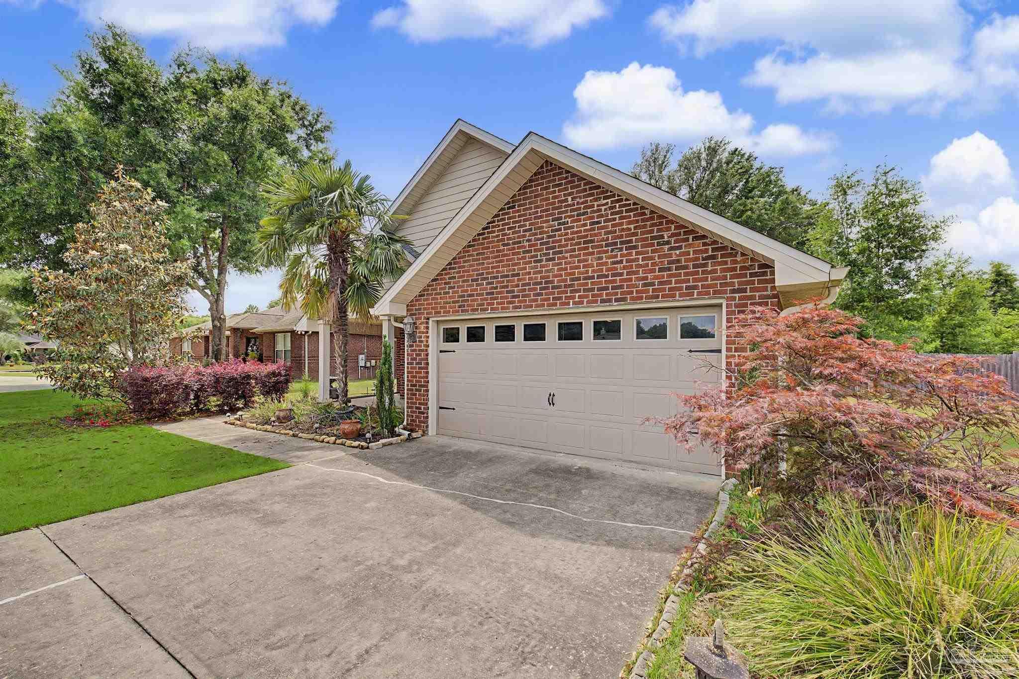5461 Tucker Circle Pace, FL 32571 - Photo 51 of 52 a view of a house with a yard