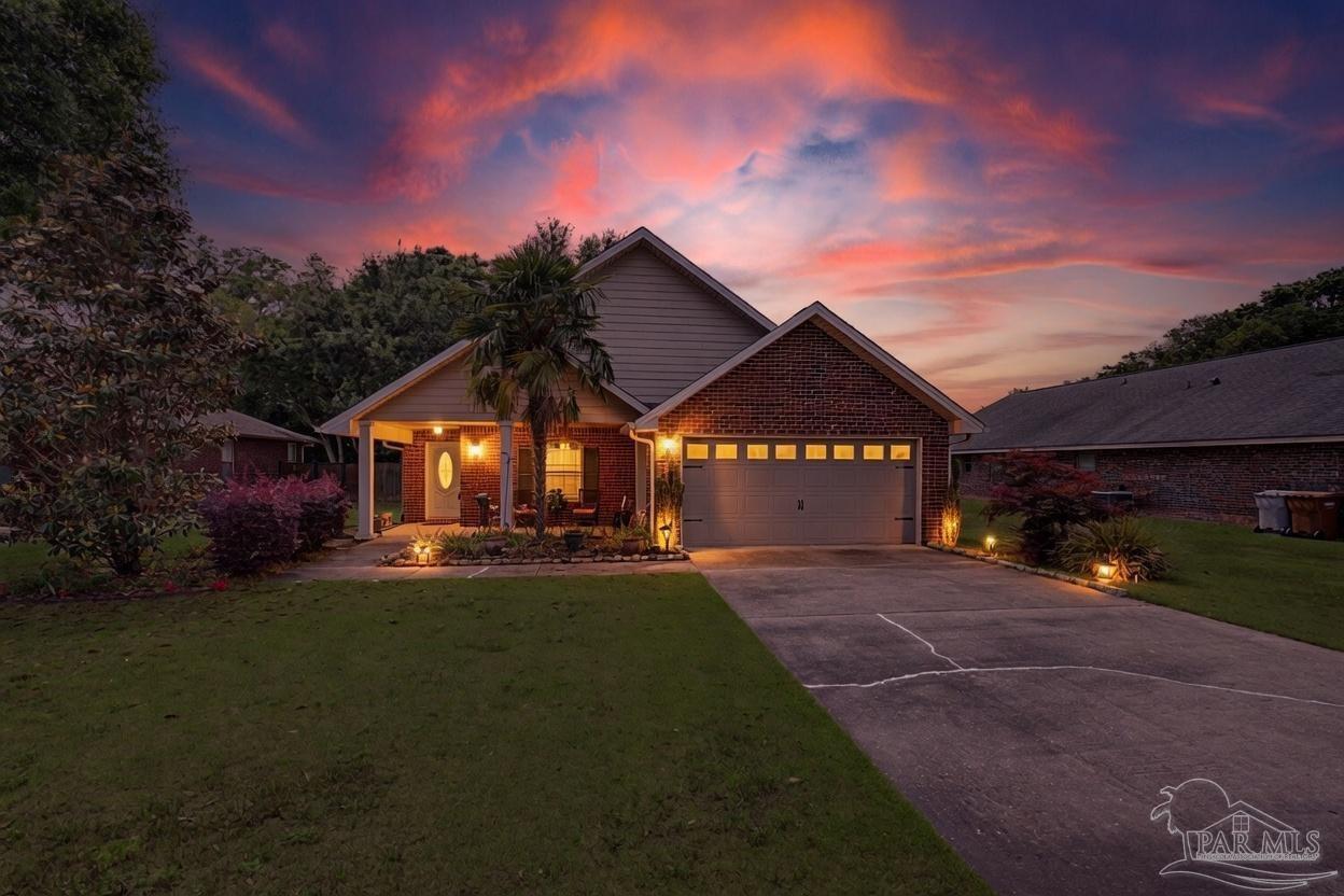 5461 Tucker Circle Pace, FL 32571 - Photo 52 of 52 a view of a house with a yard