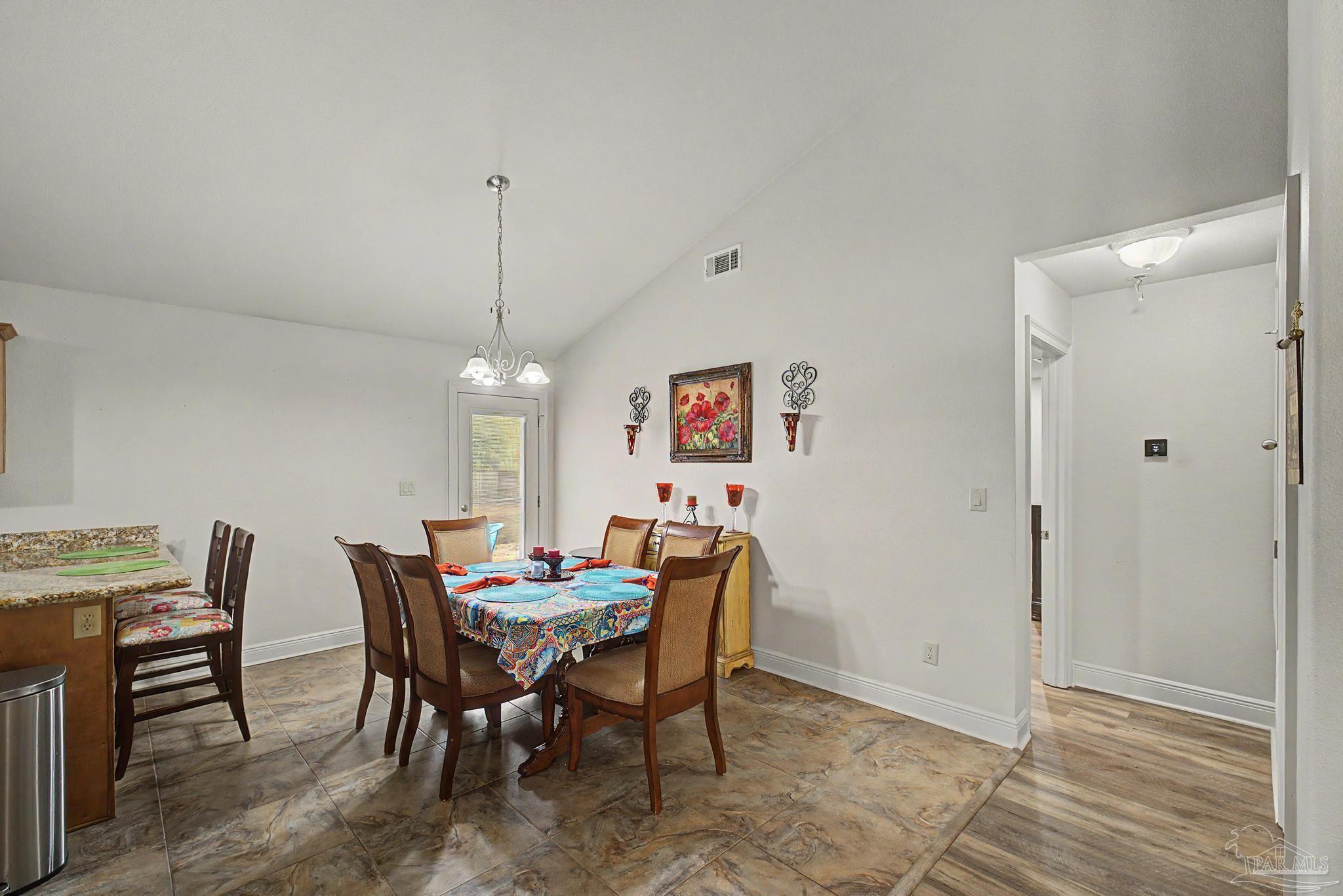 5461 Tucker Circle Pace, FL 32571 - Photo 7 of 52 a view of a dining room with furniture