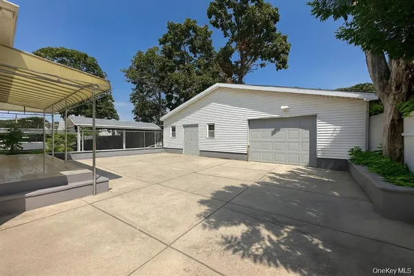 a backyard of a house with a basket ball court