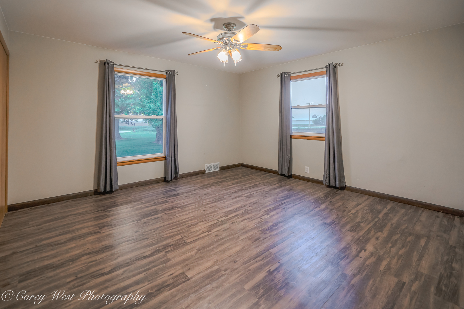 8994 Highway 64 Sycamore, IL 60178 - Photo 17 of 37 wooden floor in an empty room with a window