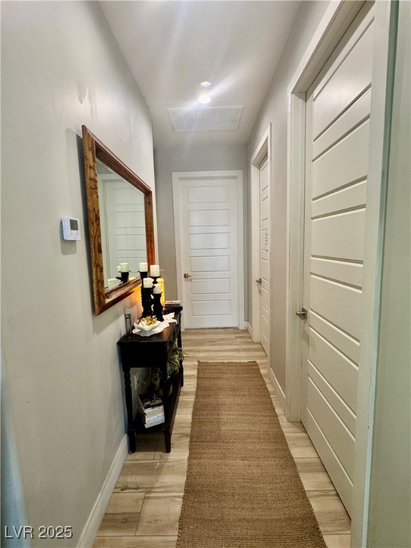 251 Spring Heights Caliente, NV 89008 - Photo 15 of 19 Hallway featuring light wood-type flooring and baseboards