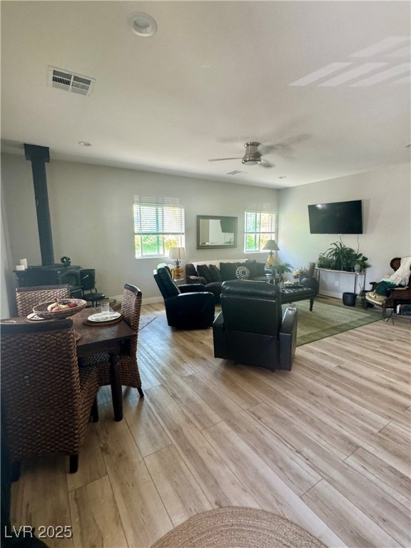 251 Spring Heights Caliente, NV 89008 - Photo 5 of 19 Living room with a wood stove and light wood finished floors
