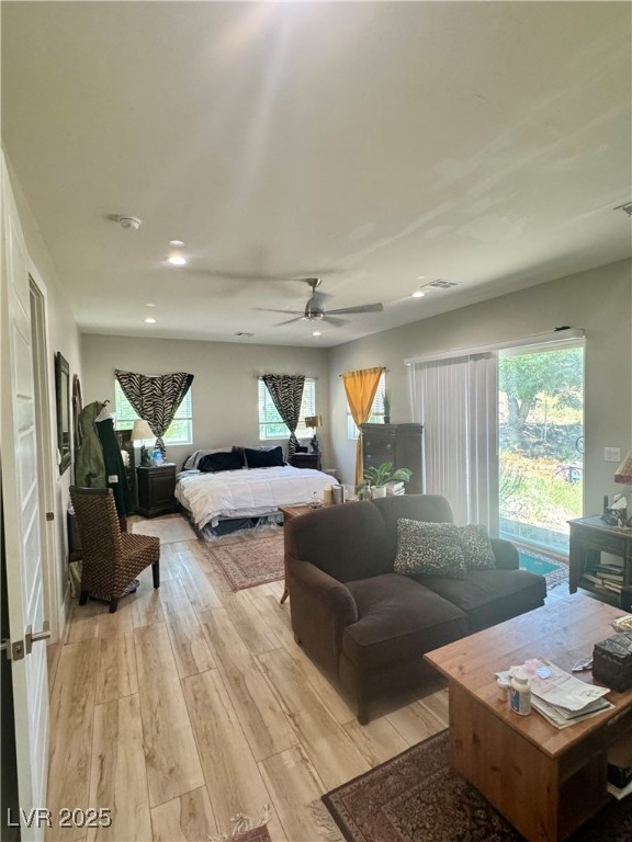 251 Spring Heights Caliente, NV 89008 - Photo 8 of 19 Bedroom with light wood finished floors, multiple windows, and ceiling fan