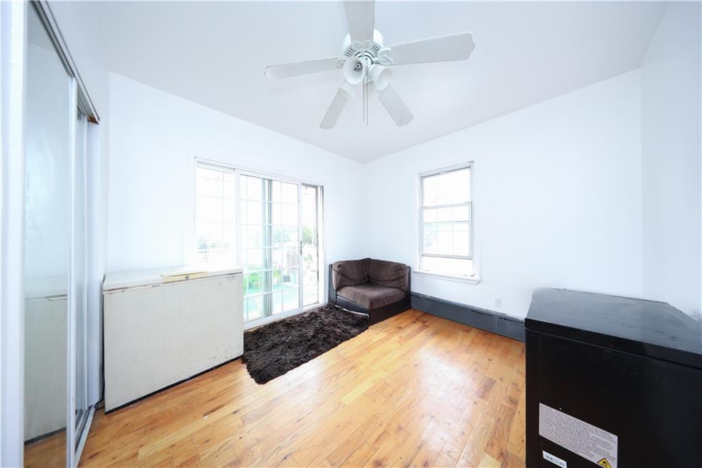 2667 Cropsey Avenue Brooklyn, NY 11214 - Photo 14 of 40 a bedroom with a bed and a window