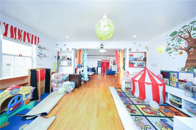 a living room filled with lots of furniture and toys