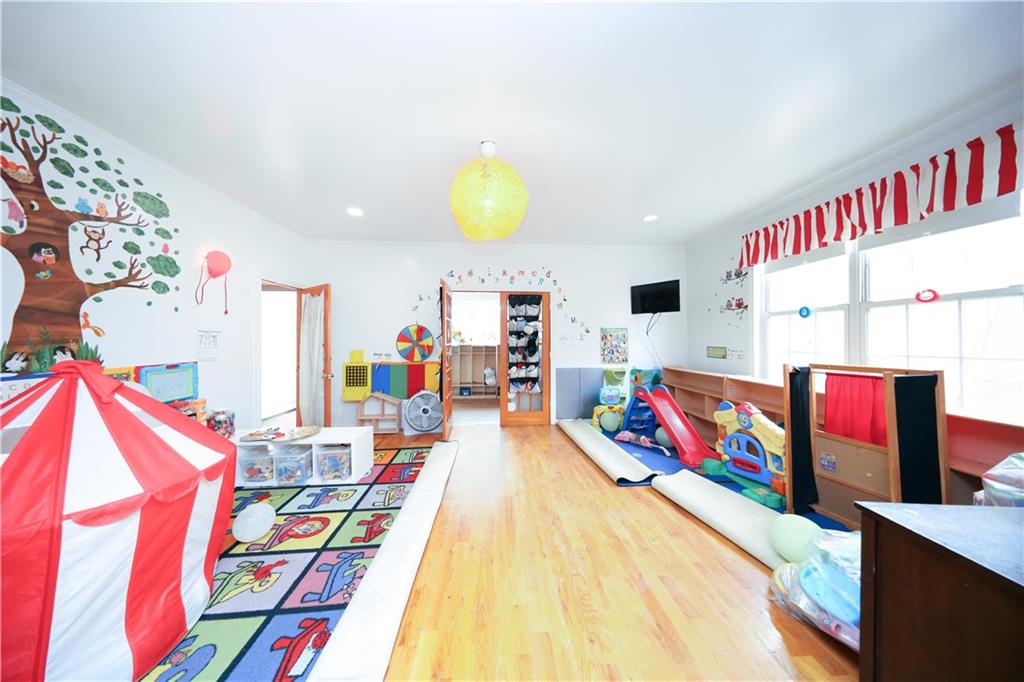 2667 Cropsey Avenue Brooklyn, NY 11214 - Photo 22 of 40 a bed room with a bed and a book shelf