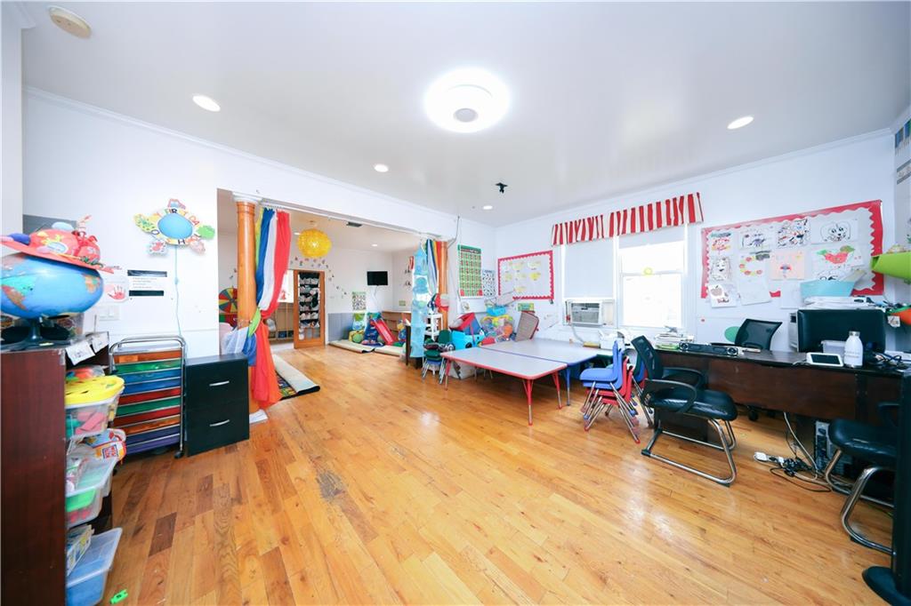 2667 Cropsey Avenue Brooklyn, NY 11214 - Photo 23 of 40 a bed room with furniture and a flat screen tv