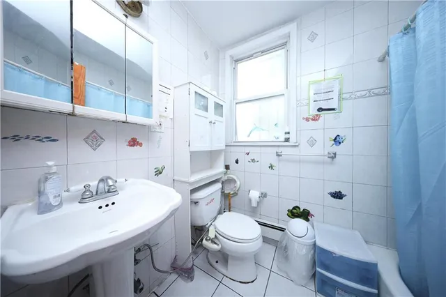 a bathroom with a sink toilet a shower and a mirror