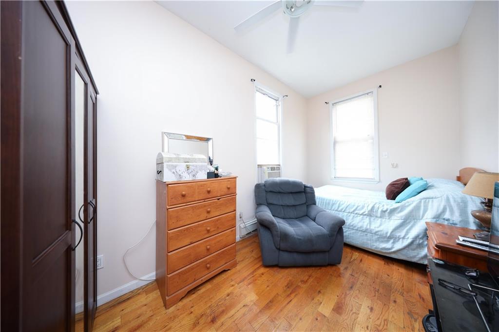 2667 Cropsey Avenue Brooklyn, NY 11214 - Photo 28 of 40 a bedroom with furniture and a window