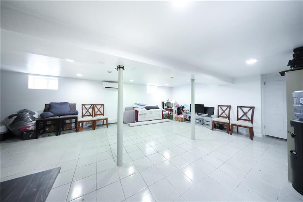 2667 Cropsey Avenue Brooklyn, NY 11214 - Photo 29 of 40 a view of a livingroom with furniture and a couch