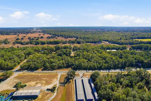an aerial view of residential building and ocean