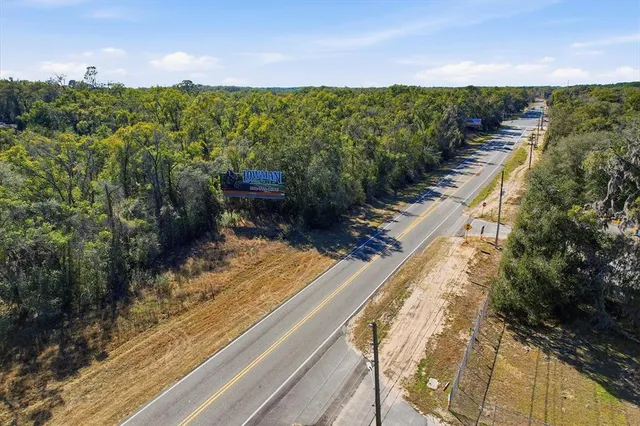 a view of a swimming pool with a yard