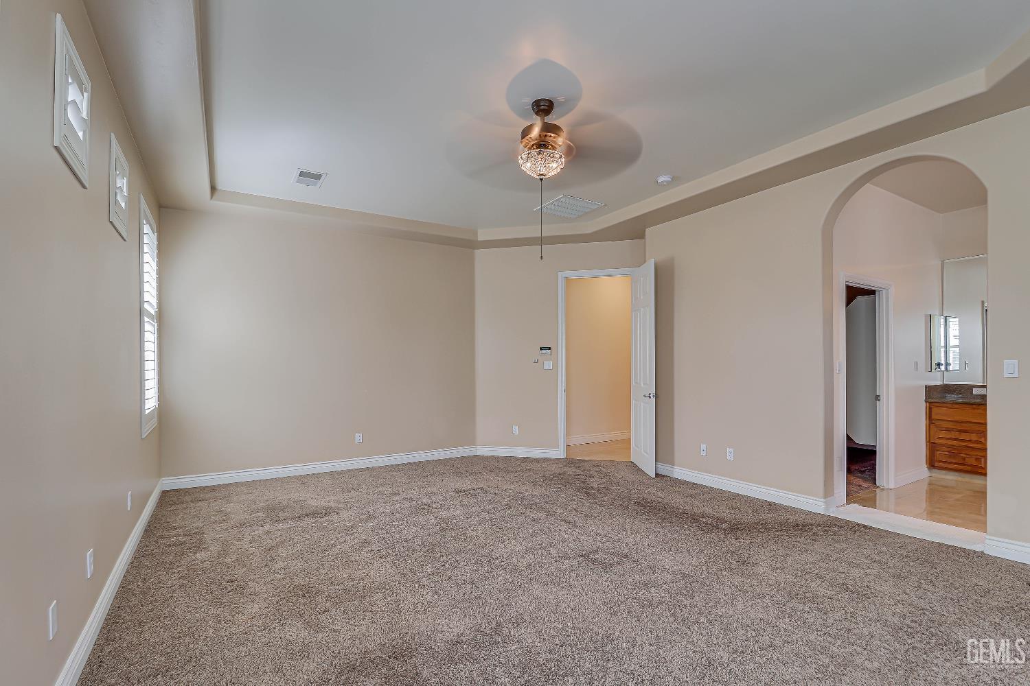 Undisclosed Address Bakersfield, CA 93311 - Photo 1 of 41 a view of an empty room with a chandelier