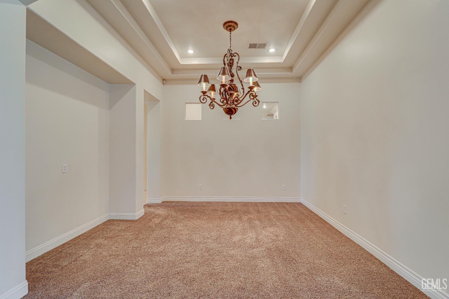 Undisclosed Address Bakersfield, CA 93311 - Photo 15 of 41 a view of a chandelier in a room