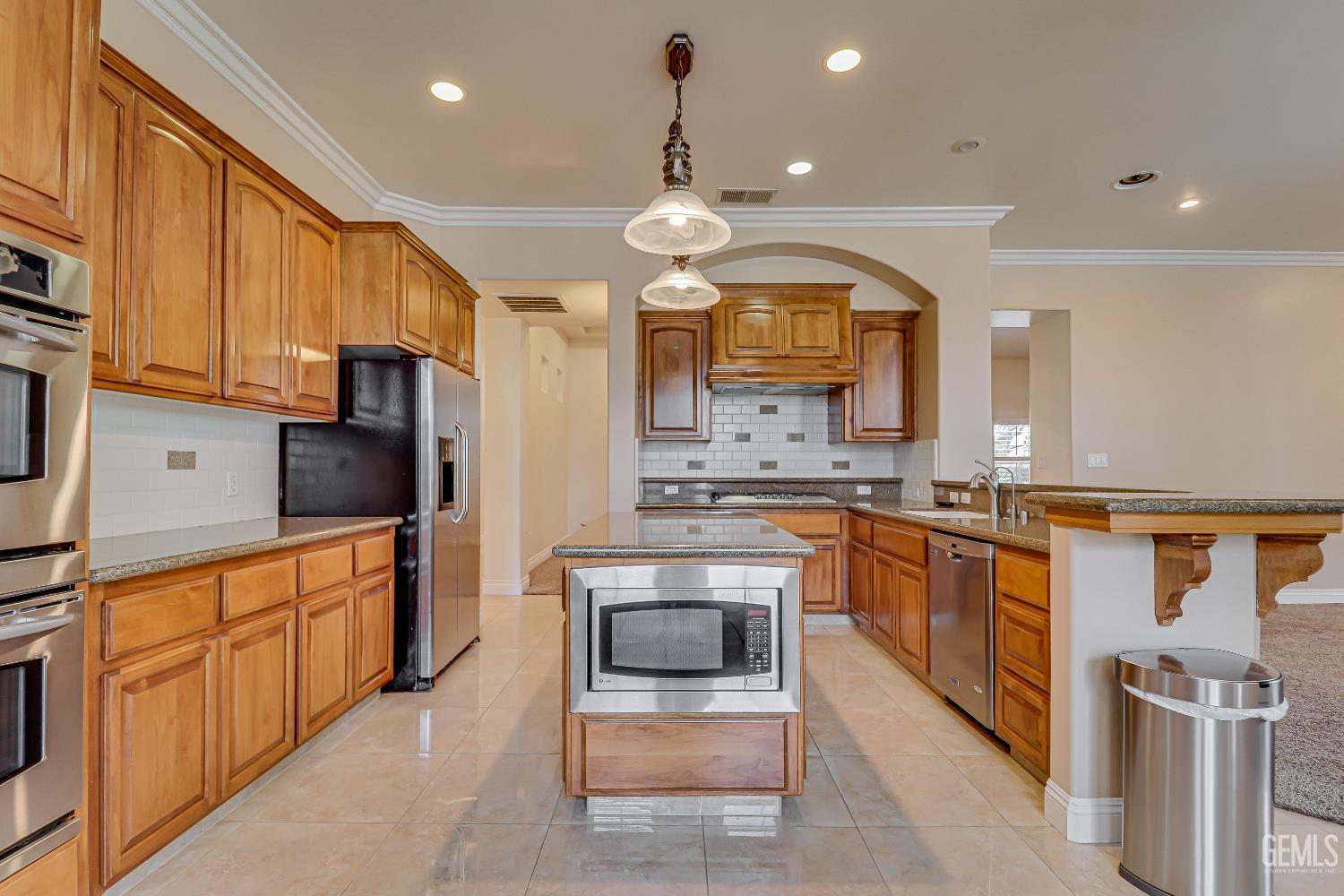 Undisclosed Address Bakersfield, CA 93311 - Photo 23 of 41 a kitchen with stainless steel appliances granite countertop a stove a sink and a refrigerator